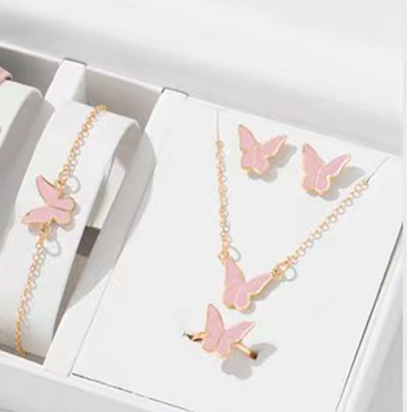 Butterfly Emblem Jewelry Set – Gold-Colored Necklace, Earrings, Bracelet & Ring with Imitation Pearls