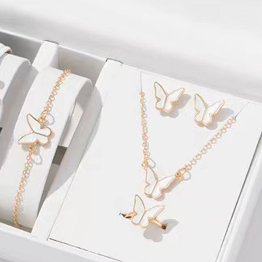 Butterfly Emblem Jewelry Set – Gold-Colored Necklace, Earrings, Bracelet & Ring with Imitation Pearls