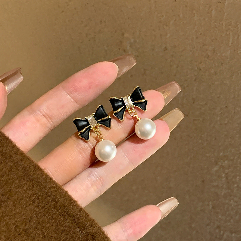 Women's Niche Black Bow Pearl Stud Earrings – Elegant & Unique Design