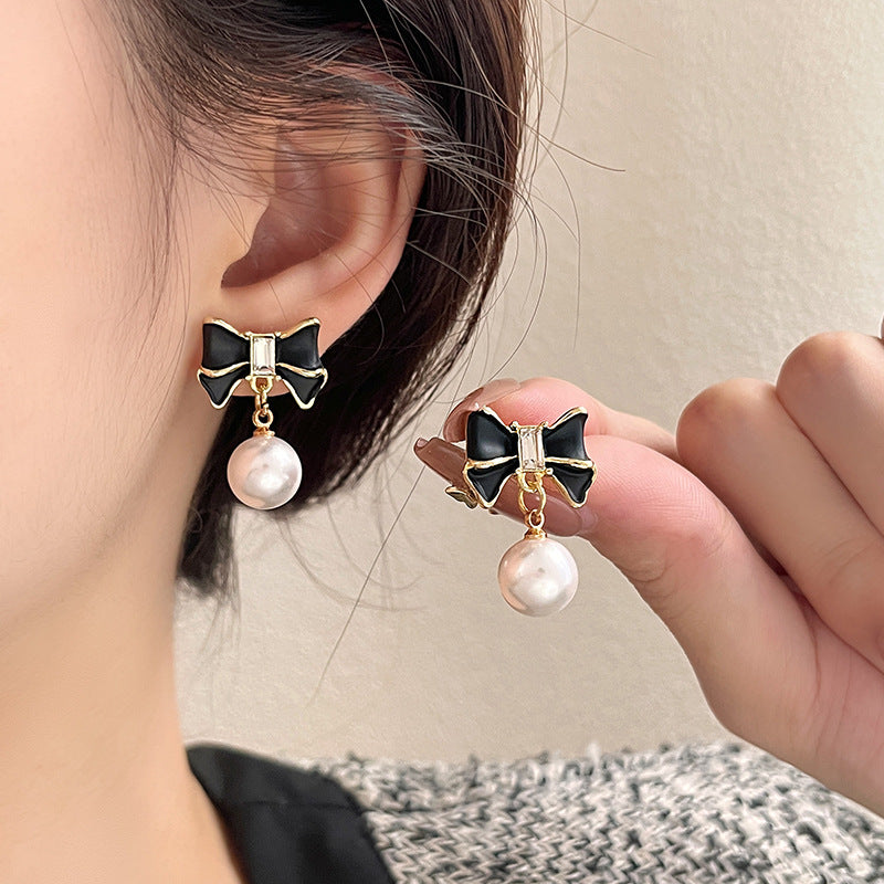 Women's Niche Black Bow Pearl Stud Earrings – Elegant & Unique Design