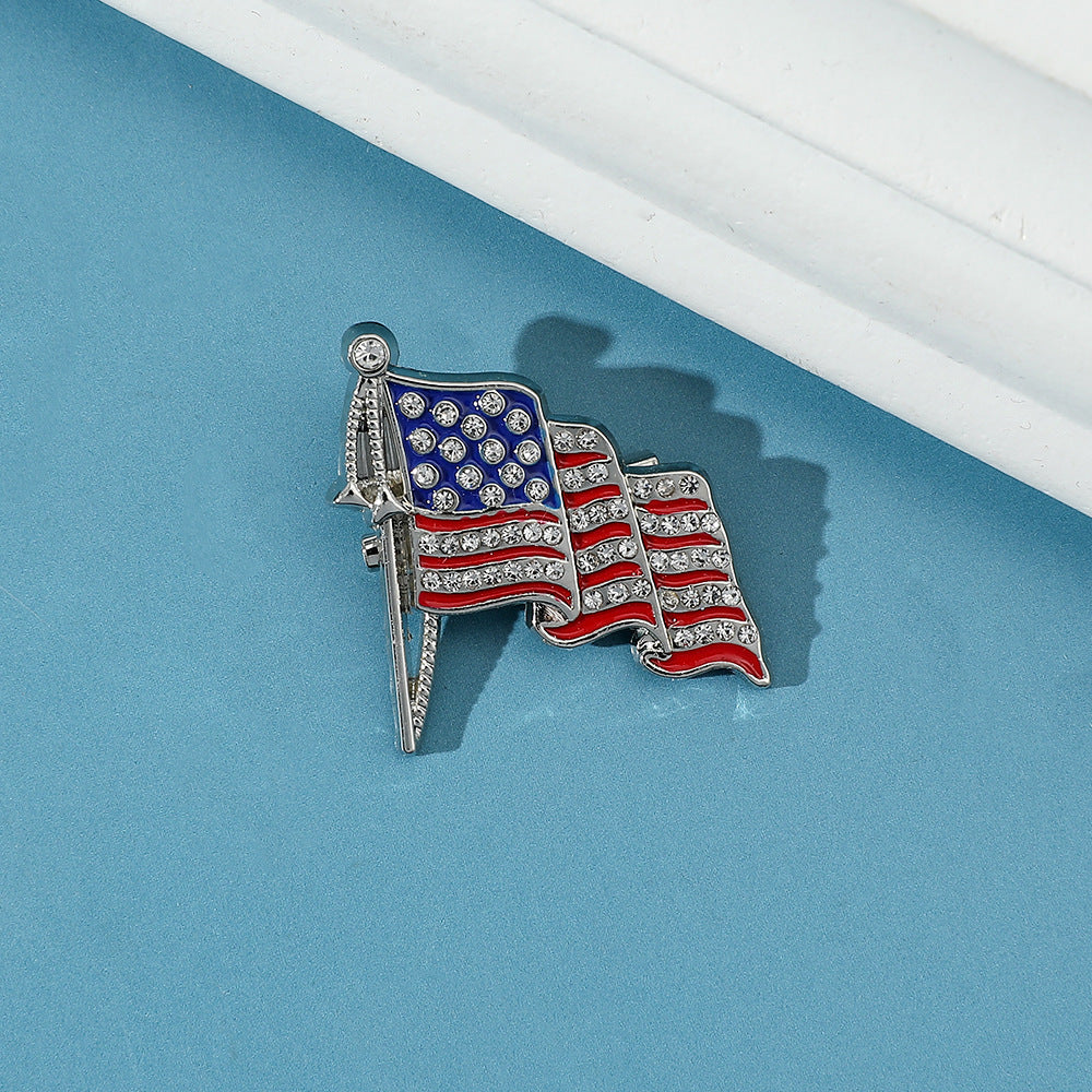 Golden “M” American Flag Brooch – Bold Patriotic Accent