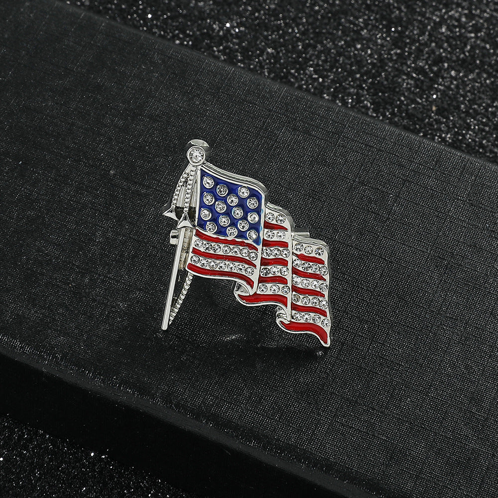 Golden “M” American Flag Brooch – Bold Patriotic Accent