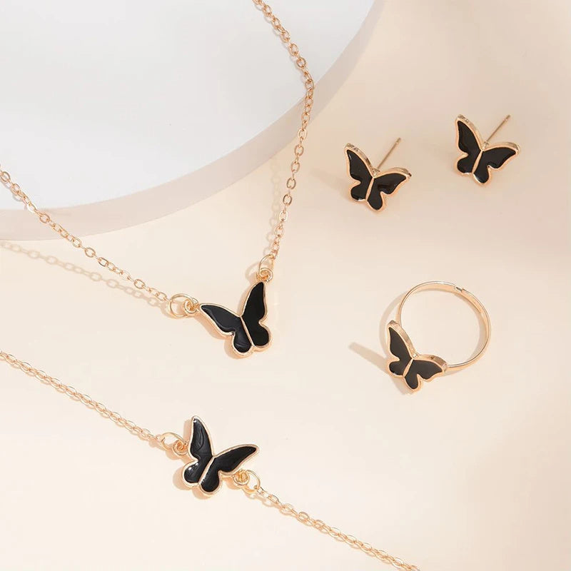 Butterfly Emblem Jewelry Set – Gold-Colored Necklace, Earrings, Bracelet & Ring with Imitation Pearls