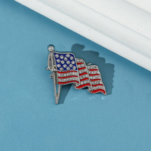 Golden “M” American Flag Brooch – Bold Patriotic Accent